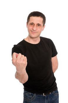 man in a black T-shirt showing a fig isolated on white background