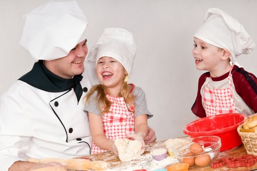 male chef tells the children something