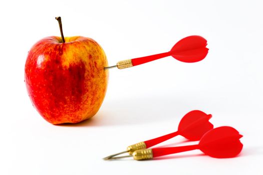 Red Apple with red Darts on White Background