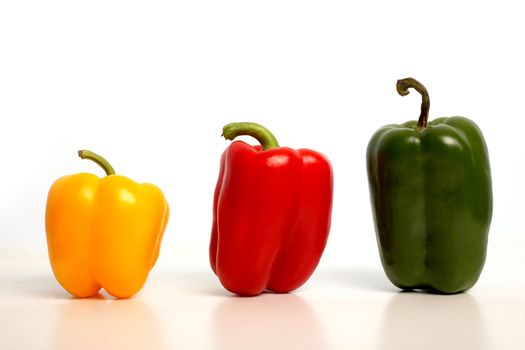 An image of color peppers in row