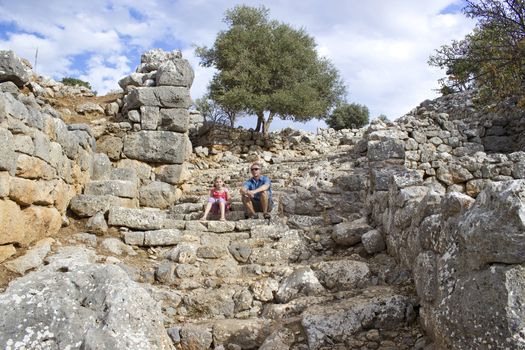 Tourists in the ruins of the ancient city of Lato, Crete