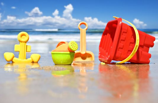 Closeup of children's beach toys at the beach