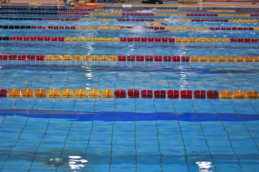 A swimming pool with blue water waves