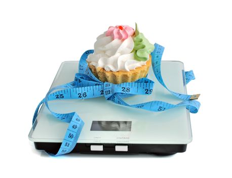 Cake tied to the centimeter scale on white background (isolated)