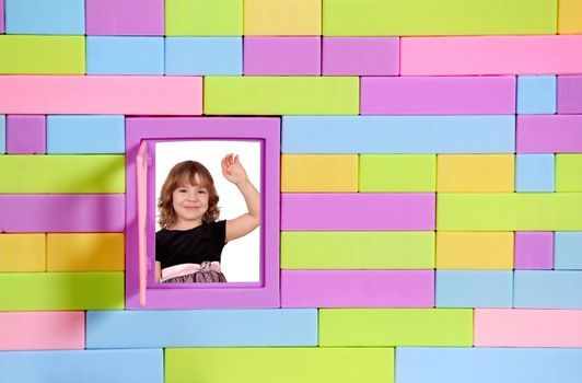 little girl greeting on window