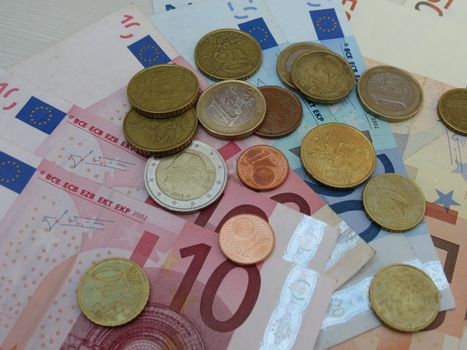 Euro (EUR) banknotes and coins money useful as a background or money concept