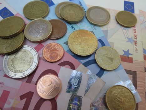 Euro (EUR) banknotes and coins money useful as a background or money concept