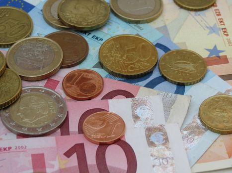 Euro (EUR) banknotes and coins money useful as a background or money concept