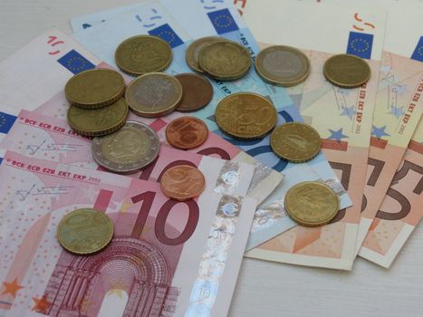 Euro (EUR) banknotes and coins money useful as a background or money concept