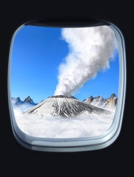 volcanic eruption view from the window of plane