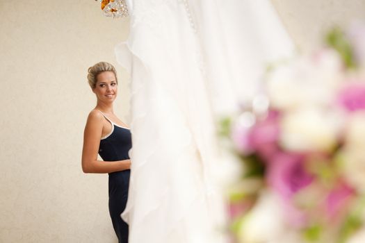 bride, bouquet of flowers and wedding dress
