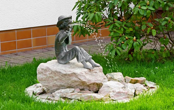 This image shows a little statue as fountain