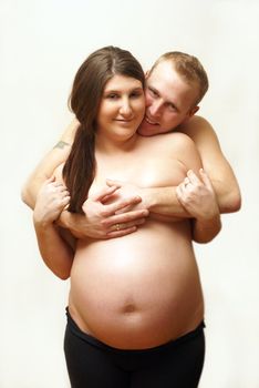 An intimate portrait of a couple who are having their first born child.