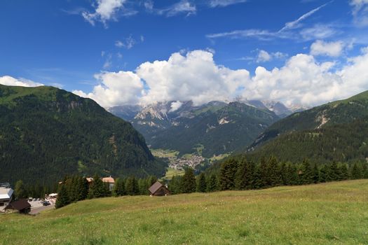 aerial view of Fassa valley with Campitello village on summer. Trentino, Italy