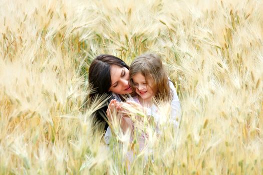 mother and daughter are happy and laugh in the rye