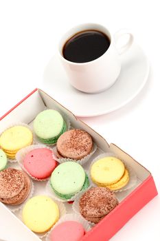 Colorful Macaroon and cup of coffee on white background
