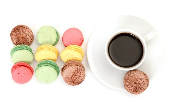 Colorful Macaroon and cup of coffee on white background