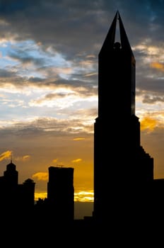 Shanghai skyscraper silhouette at dusk with clouds