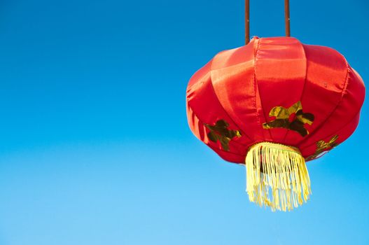 Traditional hanged chinese lantern in blue sky background