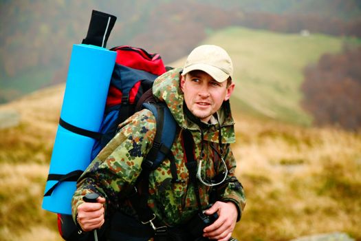 A man walking in mountains. Travel theme