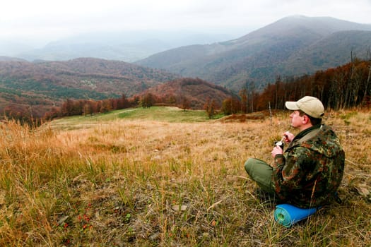 An image of a tourist in the mountains