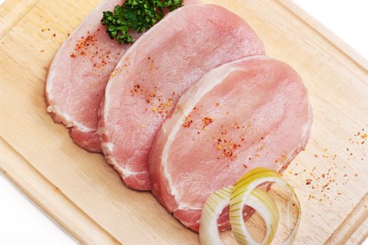 Fresh slices of pork isolated on white