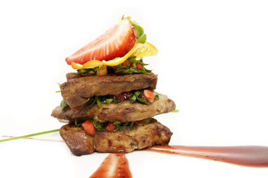 Fried goose liver with strawberries on a white background