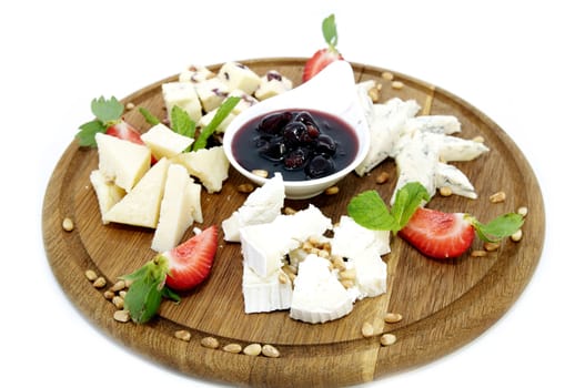 cheese plate with several kinds of cheese on a white background