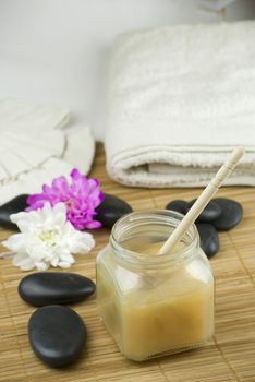 relaxing aroma of almond coconut vanilla milk and honey bath foam over wooden mat