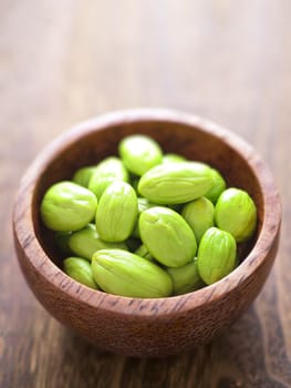 close up of a bowl of petai beans