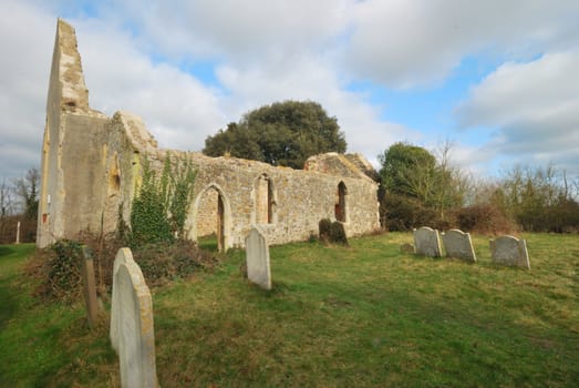 ruined parish church with dramatic sky