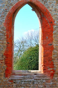 church arch way with rural view
