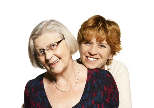 Studio shot of two women. Daughter hugging her mother.