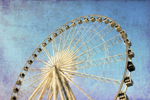 Ferris wheel with blue sky, photo in old image style