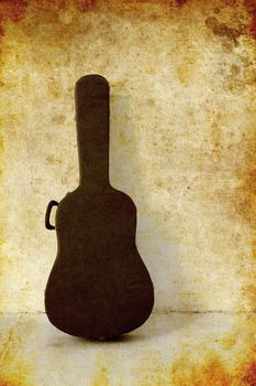 The Old Guitar case on white wall, photo in old image style