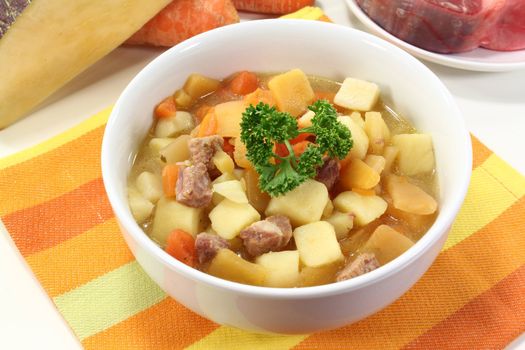 a bowl of turnip stew with parsley and cook meat