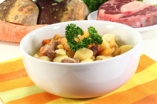 a bowl of turnip stew with parsley and cook meat