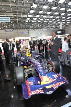 GENEVA - MARCH 16 : Redbull Formula 1 and bodyguards on display at the 82st International Motor Show Palexpo -Geneva on March 16; 2012 in Geneva, Switzerland.