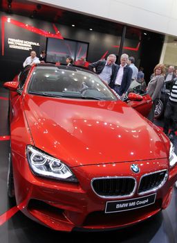 GENEVA - MARCH 16 : Red BMW M6 coupe on display at the 82st International Motor Show Palexpo -Geneva on March 16; 2012 in Geneva, Switzerland.
