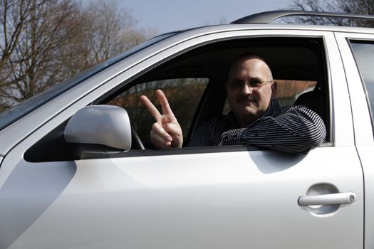 friendly car driver on the road