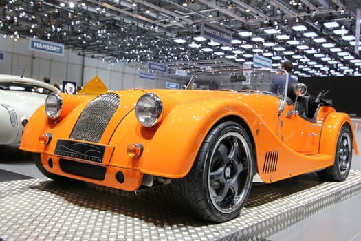 GENEVA - MARCH 16 : orange new Morgan Plus 8 on display at the 82st International Motor Show Palexpo -Geneva on March 16; 2012 in Geneva, Switzerland.