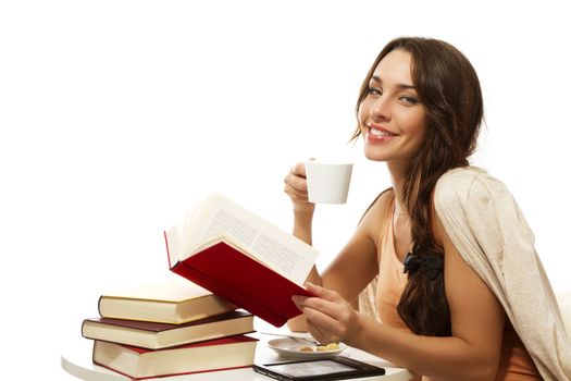 happy woman with books, coffee and ebook on white background