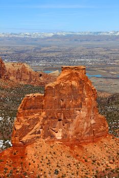 Rock monolith towering over the valley at Colorado national monument.