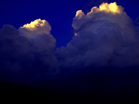 A storm front consisting of high Cumulonimbus storm clouds.