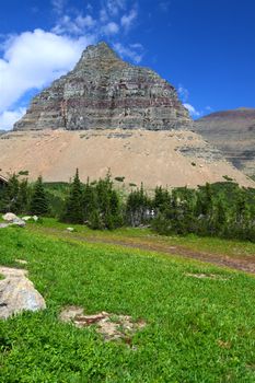 Jagged peaks rise from the ground at Logan Pass of Glacier National Park - Montana.