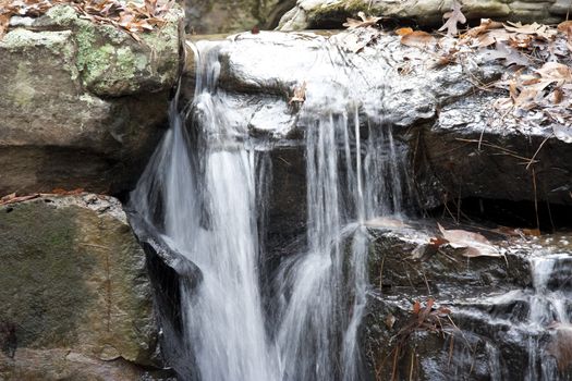 A closeup of water flowing over some rocks