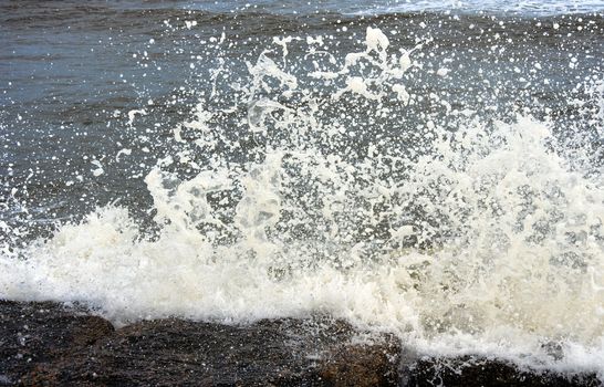 Ocean waves crashing onto some rocks