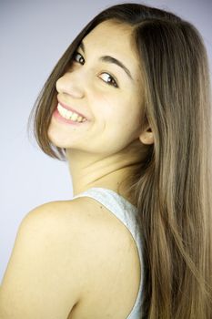 Happy girl with long hair smiling 