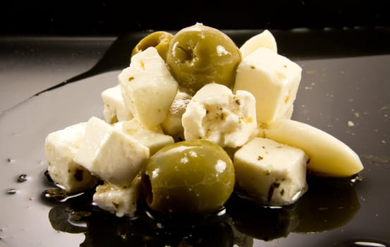 Picture of a bunch of olives, garlic and feta cheese