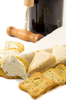 Picture of brie, cheese, crackers and a bottle of red wine